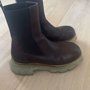 Rick Owens Bozo Tractor leather boots with a translucent sole.